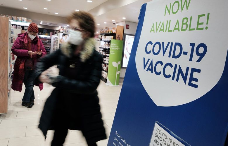A pharmacy in Grand Central Terminal advertises the COVID-19 vaccine on Thursday, Dec. 9, 2021 in New York City. As the fast-spreading new Omicron variant of COVID-19 has been detected in at least 19 states, health officials are urging Americans to get vaccinated and receive their booster shots.  (Spencer Platt/Getty Images/TNS) 34464097W 34464097W