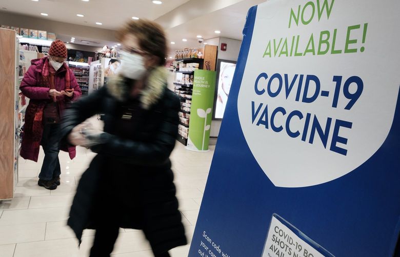 A pharmacy in Grand Central Terminal advertises the COVID-19 vaccine on Thursday, Dec. 9, 2021 in New York City. As the fast-spreading new Omicron variant of COVID-19 has been detected in at least 19 states, health officials are urging Americans to get vaccinated and receive their booster shots. (Spencer Platt/Getty Images/TNS) 34464097W 34464097W