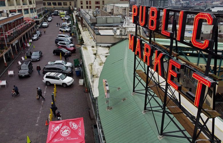 A discussion is taking place on vehicles at Pike Place Market, seen from the air Tuesday, Dec. 7, 2021 in Seattle. 218996