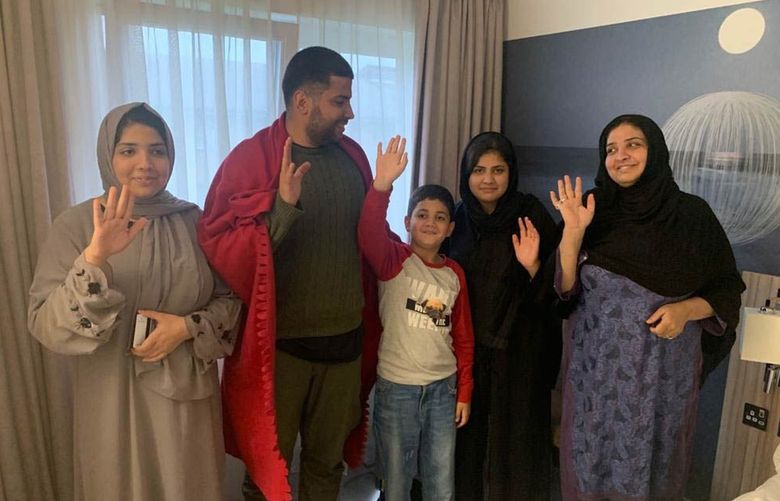 Obaid Zahid’s family poses for a group photo in a refugee hotel in Birmingham, England on Aug. 29, 2021. From left to right are Zahid’s children Shabnam, 14, Yousuf, 21, Younus, 11, Sadaf, 12, and Obaid’s wife Nafisa. (Photo contributed by Obaid Zahid)
