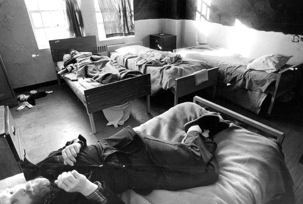 With four beds packed in a two-bed room, there is barely enough space for Western State Hospital patients to move in the hospital’s treatment and evaluation ward as seen in 1982. (Chris Johns / The Seattle Times)