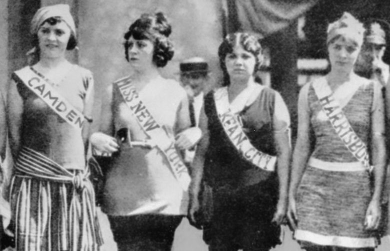 FILE – Contestants in the first Miss America pageant line up for the judges in Atlantic City, N.J., in September 1921. The competition is marking its 100th anniversary on Thursday, Dec. 16, 2021, having managed to maintain a complicated spot in American culture with a questionable relevancy. (AP Photo/File) BMNY601 BMNY601