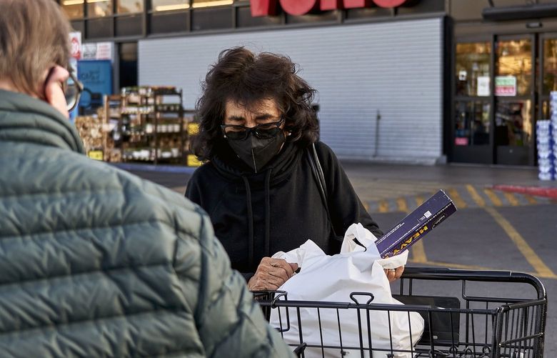 Grocery shopping in Los Angeles on Wednesday, Dec. 8, 2021. As day-to-day costs rise, workers may begin to ask for raises to help offset the financial blow. (Philip Cheung/The New York Times)
