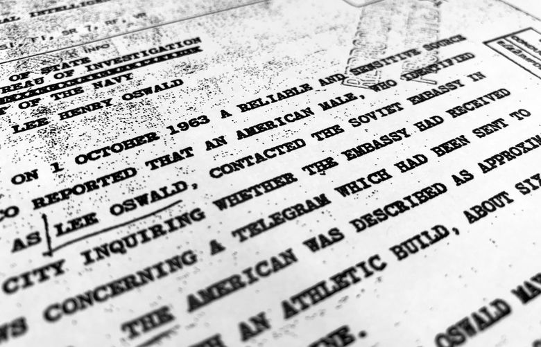 FILE – Part of a file from the CIA, dated Oct. 10, 1963, details “a reliable and sensitive source in Mexico” report of Lee Harvey Oswald’s contact with the Soviet Union embassy in Mexico City, that was released Nov. 3, 2017, by the National Archives. The National Archives has made public on Dec. 15, 2021, nearly 1,500 documents related to the U.S. government’s investigation into the 1963 assassination of President John F. Kennedy(AP Photo/Jon Elswick, File) WX129 WX129