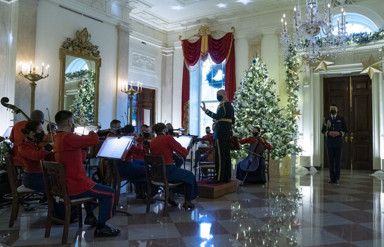 A Marine band plays Christmas music in the Grand Foyer of the White House during a press preview of the White House holiday decorations, Monday, Nov. 29, 2021, in Washington. (AP Photo/Evan Vucci) DCEV137 DCEV137
