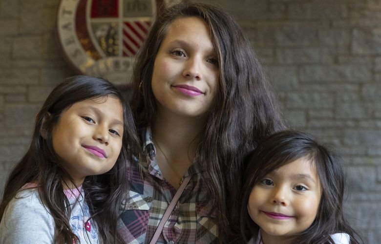 Blandy Inzunza, a 22-year-old Seattle University student, poses with her two children, Kaelani, 7, (l) and Mia, 3 (turns 4 on Dec. 10) in the Student Center on the S. U. campus Friday, December 3, 2021.  

 Blandy has gotten help from Treehouse since she was a teenager in foster care. She is the only one of eight siblings to have graduated from high school, and says she would not have done so with Treehouse’s support. The organization now helps her with groceries, gas, clothes and moral support as she takes pre-med classes at Seattle University. 218958