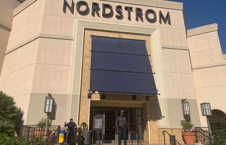FILE – A security guard stands outside the Nordstrom store at The Grove retail and entertainment complex in Los Angeles, on Nov. 23, 2021. Prosecutors and retailers are pushing back on assertions by Californiaâ€™s governor and attorney general that they have enough tools to combat shoplifting. California Retailers Association president Rachel Michelin says shoplifting has been a growing problem. (AP Photo/Eugene Garcia, File) LA208 LA208