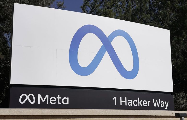 The new Meta sign at the company headquarters in Menlo Park, Calif., in October 2021 when the parent company changed its name from Facebook to Meta Platforms.  (AP Photo/Tony Avelar, File) 