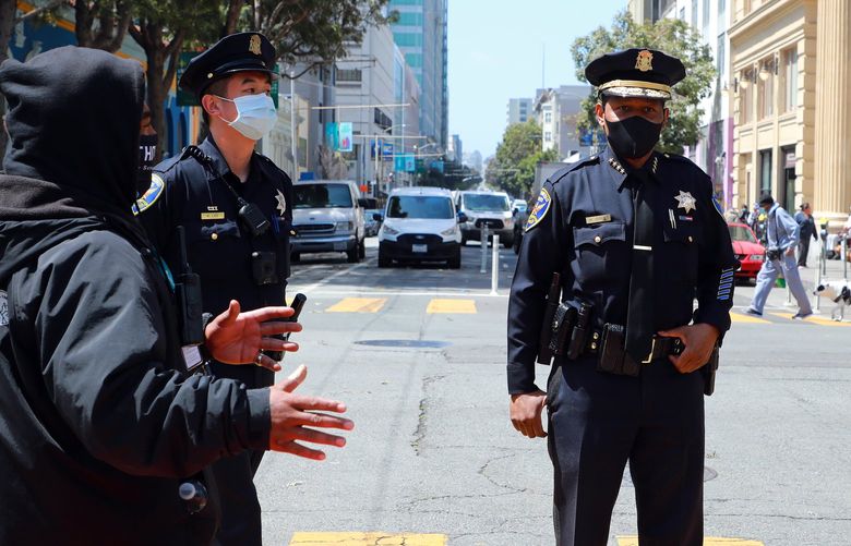 FILE — San Francisco Police Chief William Scott speaking with outreach workers in the Tenderloin neighborhood of San Francisco on April 13, 2021. The mayor of San Francisco on Friday, Dec. 17, 2021 declared a state of emergency in the Tenderloin neighborhood, one of the most crime-ridden and drug infested parts of the city. (Jim Wilson/The New York Times) XNYT105 XNYT105