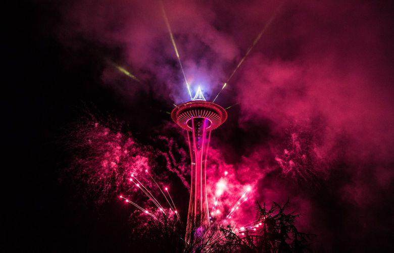 Fireworks shoot off from the Space Needle on Monday, December 31, as a part of the New Years Eve at the Needle celebration before the fireworks. 208871