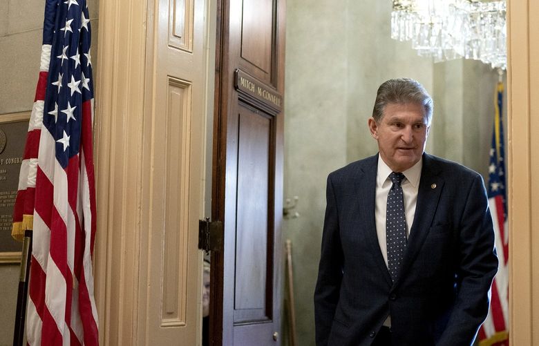 Sen. Joe Manchin (D-W.V.) leaves the office of Senate Minority Leader Mitch McConnell (R-Ky.) on Capitol Hill in Washington, Dec. 16, 2021. Manchin said he was opposed to legislation that includes climate action designed to keep the planet from dangerously overheating. (Stefani Reynolds/The New York Times) XNYT54 XNYT54