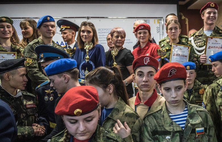 An awards ceremony for a patriotic club in Vladimir, Russia, on December 16, 2021. Students from across the country competed in activities such as map reading and shooting.  (Sergey Ponomarev / The New York Times)