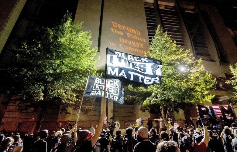 FILE – In this July 31, 2020 file photo, Black Lives Matter protesters gather at the Mark O. Hatfield United States Courthouse in Portland, Ore. At least two federal buildings in Portland have been closed and the FBI is investigating after a threat of violence was reported, the officials said Friday, Aug. 21, 2020. Investigators are trying to determine whether the threat is credible, the FBI said in a statement. The Mark O. Hatfield Federal courthouse, which was the site of weeks of violent protests last month, was closed, as was the Portland office of the U.S. Bankruptcy Court. (AP Photo/Noah Berger, File)
