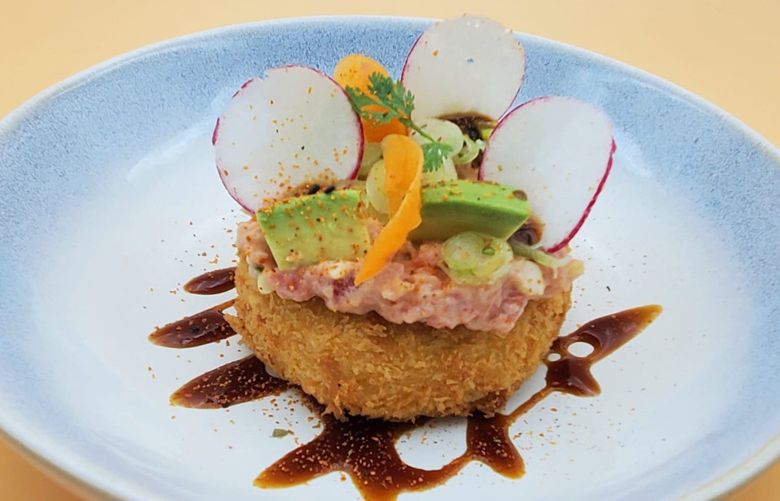 Senor Carbon is the new Peruvian restaurant in Pioneer Square. Picture is one of its Peruvian-Japanese dishes,  Causa, a mashed potato cake made with aji amarillo, topped with tuna tartare and spicy rocoto mayonnaise, sesame oil and unagi sauce.