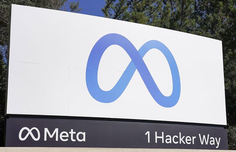 FILE – Facebook unveiled their new Meta sign at the company headquarters in Menlo Park, Calif., on, Oct. 28, 2021. Meta, formerly known as Facebook, and ridesharing company Lyft separately announced Tuesday, Dec. 7, 2021, that they’re letting workers delay their return when offices fully reopen early next year. (AP Photo/Tony Avelar, File) NYDD205