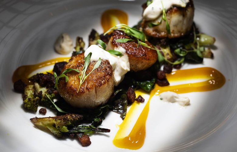 The Pan Seared Scallops at Charcoal features swiss chard, romanesc, pancetta, golden beet purée, and jalapeño.

Charcoal is the hot new restaurant in Edmonds.  Photographed Thursday, Dec. 23, 2021 219162