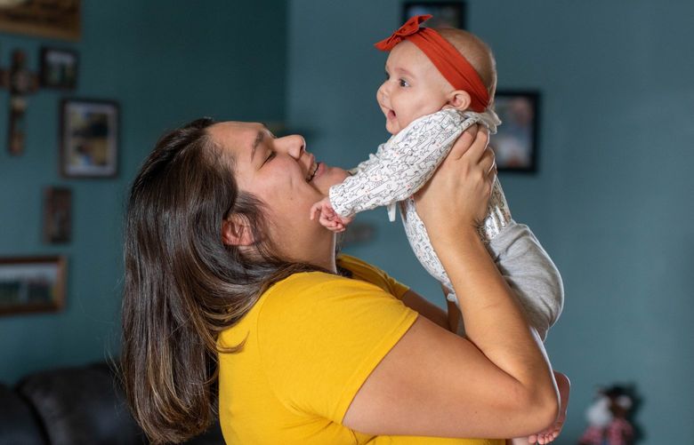 Mashaya Engel plays with her daughter, Ava, in their home in Reliance, S.D. MUST CREDIT: Washington Post photo by Jay Pickthorn