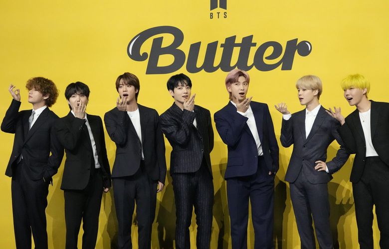 FILE- Members of South Korean K-pop band BTS, V, SUGA, JIN, Jung Kook, RM, Jimin, and j-hope from left to right, pose for photographers ahead of a press conference to introduce their new single “Butter” in Seoul, South Korea, Friday, May 21, 2021. Three members of the K-pop superstar group BTS have been infected with the coronavirus. Â the Big Hit Entertainment agency says in a statement that RM and Jin were diagnosed with COVID-19 on Saturday evening. It earlier said another member, Suga, tested positive for the virus on Friday. (AP Photo/Lee Jin-man, File) XSEL101 XSEL101