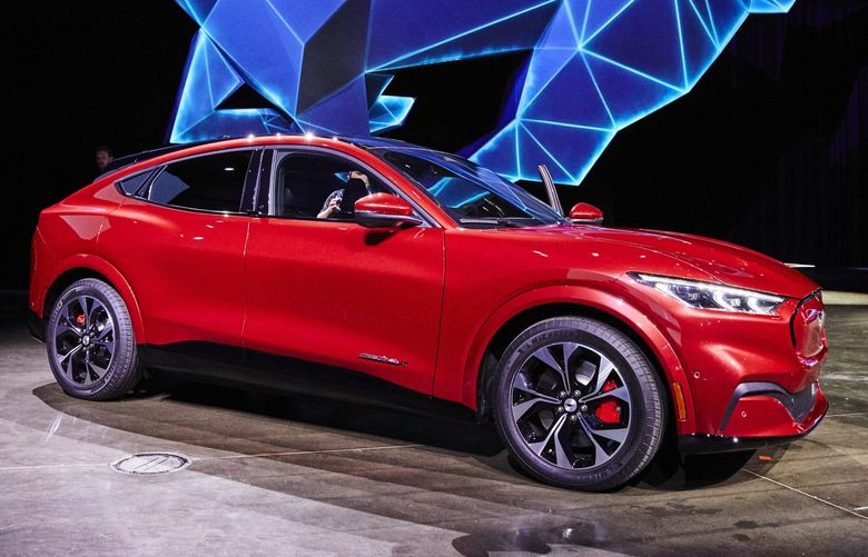 FILE — Ford’s electric vehicle, the Mustang Mach-E, an SUV meant to evoke the company’s storied sports car, in Los Angeles, Nov. 17, 2019. The struggles of traditional automakers to sell electric cars might finally ease in 2021 as Ford, Volkswagen and others introduce promising new models. (Ryan Young for The New York Times) XNYT43