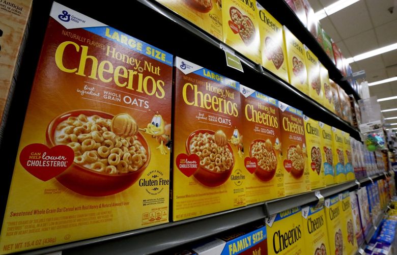 FILE- In this Aug. 8, 2018, file photo boxes of General Mills Honey Nut Cheerios cereal sit on display in a market in Pittsburgh. General Mills Inc. reports financial results Wednesday, Sept. 18, 2019. (AP Photo/Gene J. Puskar, File)