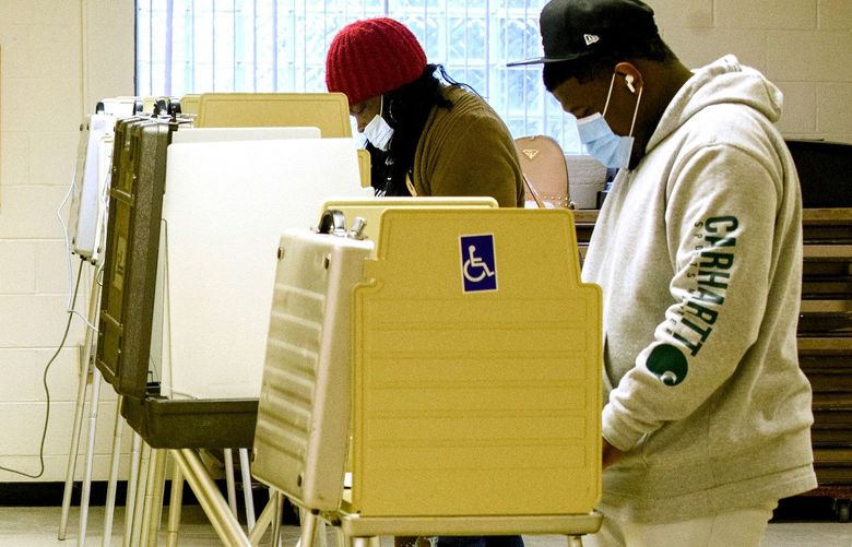 Voters cast ballots in Detroit on Election Day, Nov. 3, 2020. Michigan’s new districts will much more closely reflect the overall partisan makeup of the state.