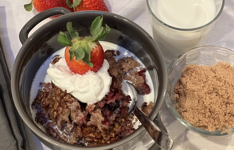 A bowl of oven-baked oatmeal is a hearty and delicious alternative to plain stovetop oatmeal. Already loaded with berries and nuts, it’s served up here with fresh strawberies and a big dollop of yogurt. Credit: David Miller