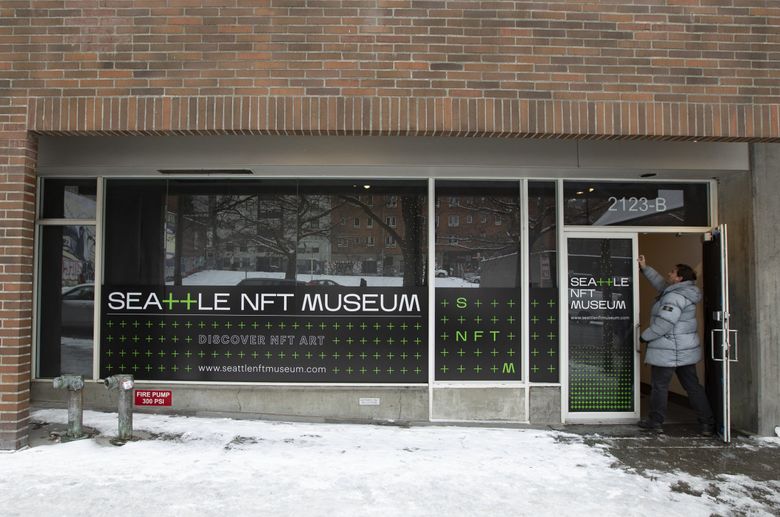 Peter Hamilton, who co-founded the Seattle NFT Museum with Jennifer Wong, is seen last week in the doorway of the new space dedicated to non-fungible token-marked digital art and the NFT community. Doors will open to the public Jan. 14. (Ken Lambert / The Seattle Times)