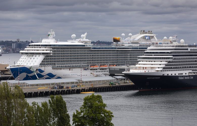 Two cruise ships are tied up at Terminal 91 in Seattle Tuesday, July 20, 2021. The first cruise ship to leave Seattle for Alaska since the start of the pandemic, the Two cruise ships are tied up at Terminal 91 in Seattle Tuesday, July 20, 2021. The first cruise ship to leave Seattle for Alaska since the start of the pandemic, the Serenade of the Seas with Royal Caribbean, left Seattle from Terminal 91 Monday, July 19, 2021. The ship at left is the Majestic Princess, operated by Princess Cruises and the ship at right is the Nieuw Amsterdam with the Holland America Line. In the background at left (in front of the Seattle Great Wheel) is another cruise ship tied up at Pier 66 on the Seattle waterfront. 217673