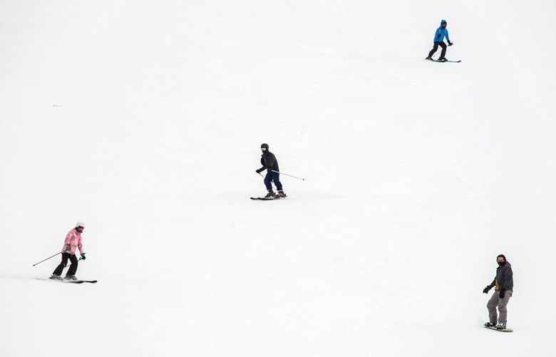Skiers and Snowboarders recreate at Stevens Pass ski area in the Cascade Mountains Tuesday, March 9, 2021.  216589