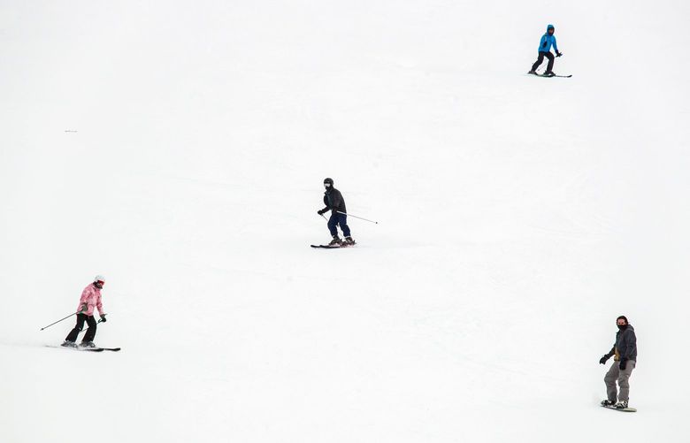 Skiers and Snowboarders recreate at Stevens Pass ski area in the Cascade Mountains Tuesday, March 9, 2021. 216589