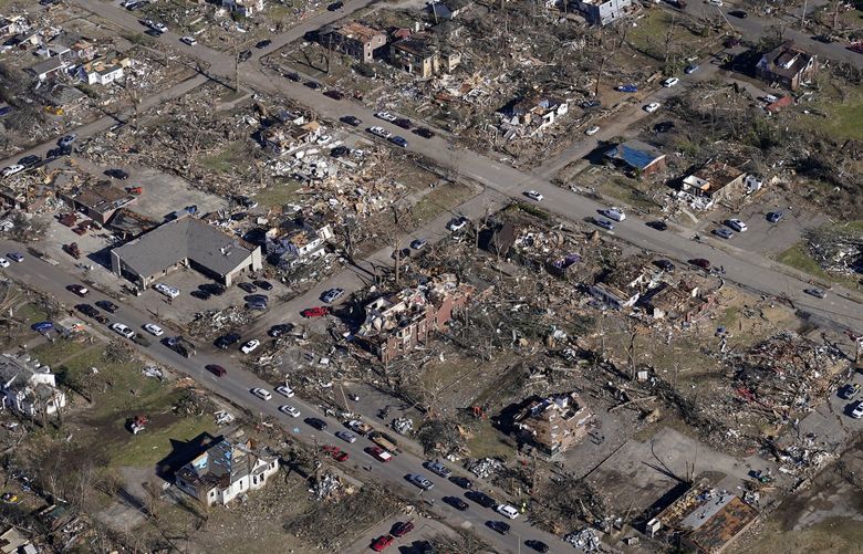 In this aerial photo, destruction in downtown Mayfield, Ky. is seen Sunday, Dec. 12, 2021, in the aftermath of tornadoes that tore through the region. (AP Photo/Gerald Herbert) KYGH123 KYGH123