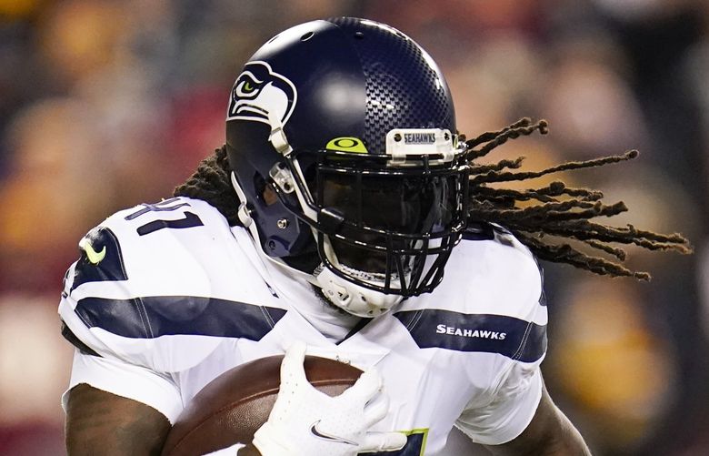 Seattle Seahawks running back Alex Collins runs with the ball during the second half of an NFL football game between the Washington Football Team and the Seattle Seahawks, Monday, Nov. 29, 2021, in Landover, Md. Washington won 17-15. (AP Photo/Julio Cortez) FDX FDX