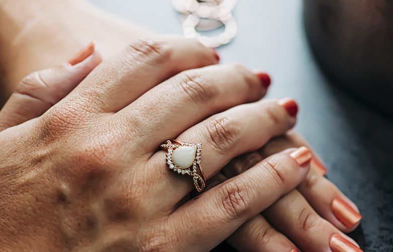 In a photo provided by Andrew DiMaio shows, Breast milk jewelry which according to Ann Marie Sharoupim, the founder of Mamma’s Liquid Love, said customers should treat like a pearl: Keep it dry and limit its exposure to chemicals. (Andrew DiMaio via The New York Times) — NO SALES; FOR EDITORIAL USE ONLY WITH NYT STORY BREAST MILK JEWELRY BY EMMA GRILLO FOR DEC. 27, 2021. ALL OTHER USE PROHIBITED. —