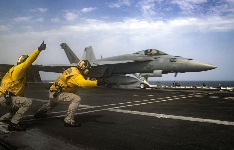 FILE- In this May 16, 2019 file photo, released by the U.S. Navy, an F-18 Super Hornet is launched from the deck of the USS Abraham Lincoln aircraft carrier in the Arabian Sea. For decades considered a U.S. national security priority, the Persian Gulf remains home to tens of thousands of American troops spread across sprawling bases protecting crucial routes for global energy supplies. But while U.S.-Iran tensions in the Gulf appeared close to sparking a global conflagration this summer, attention now rapidly has shifted to Syria. (Mass Communication Specialist 3rd Class Jeff Sherman, U.S. Navy via AP, File)