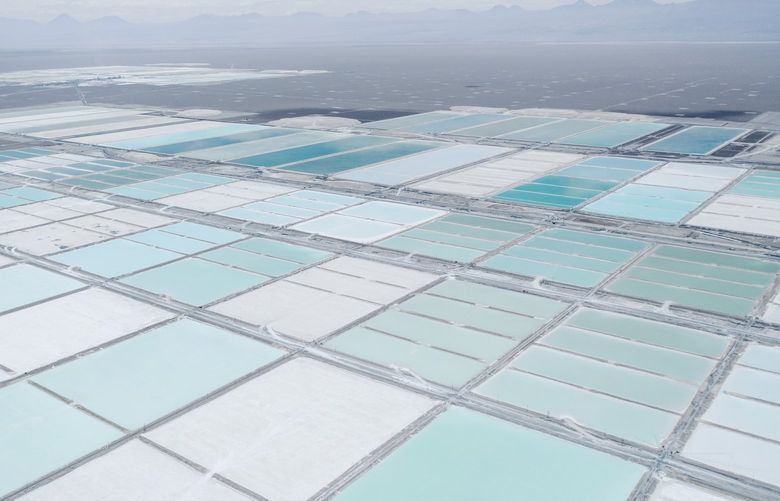 An aerial view of evaporation ponds at a lithium plant in the Atacama Desert of Chile, an essential component of batteries that is mined from the country’s salt flats, Dec. 15, 2021. After months of protests over social and environmental grievances, 155 Chileans have been elected to write a new constitution amid what they have declared a “climate and ecological emergency.” (Marcos ZegersThe New York Times)