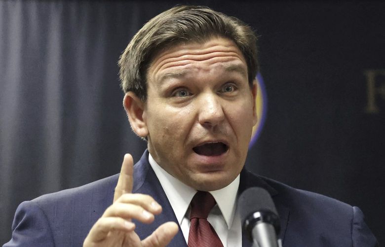 Florida Gov. Ron DeSantis arrives to announce a proposal for an increase in pay for state law enforcement agencies to encourage more officers to relocate to Florida, during a news conference at the Florida Highway Patrol Troop D headquarters in Orlando, Fla. Monday, Nov. 29, 2021. (Joe Burbank/Orlando Sentinel via AP) FLORL201 FLORL201