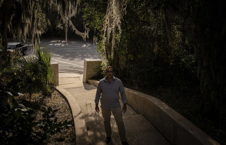 Joseph Moore stands for a portrait at a park in Jacksonville, Fla., on Wednesday, Dec. 8, 2021. Moore worked for nearly 10 years as an undercover informant for the FBI, infiltrating the Ku Klux Klan in Florida, foiling at least two murder plots, according to investigators, and investigating ties between law enforcement and the white supremacist organization. (AP Photo/Robert Bumsted) NY606 NY606