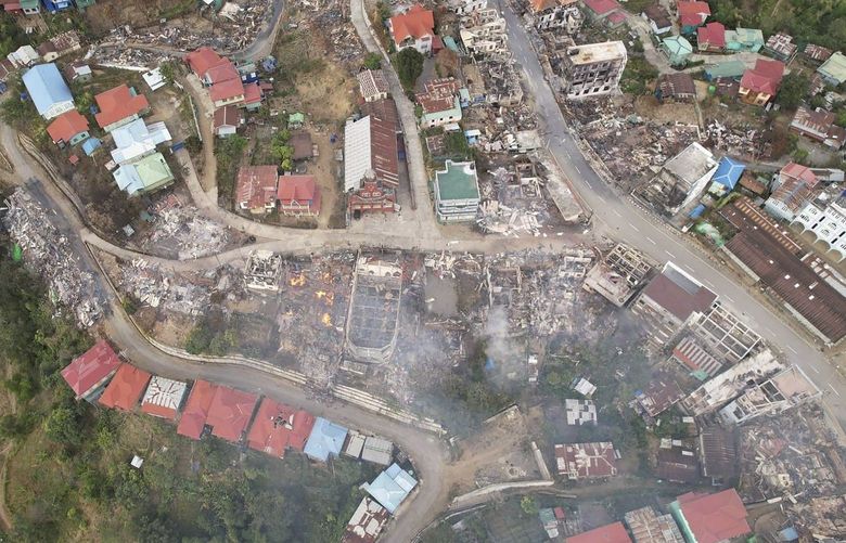 In this aerial photo released by the Chin Human Rights Organization, fires destroy numerous buildings in the town of Thantlang in Chin State in northwest Myanmar, on Dec. 4, 2021. More than 580 buildings have been burned since September, according to satellite image analysis by Maxar Technologies. (Chin Human Rights Organization via AP) MMR318 MMR318