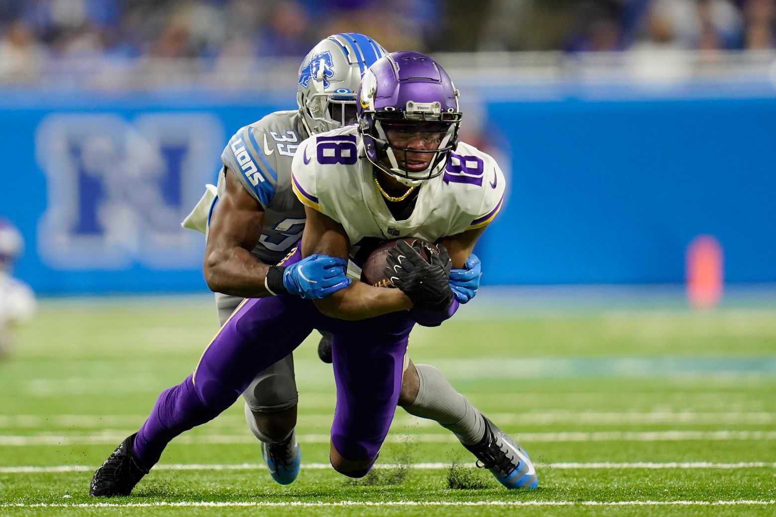 DETROIT, MI - DECEMBER 11: Minnesota Vikings wide receiver Justin Jefferson  (18) makes a catch and i