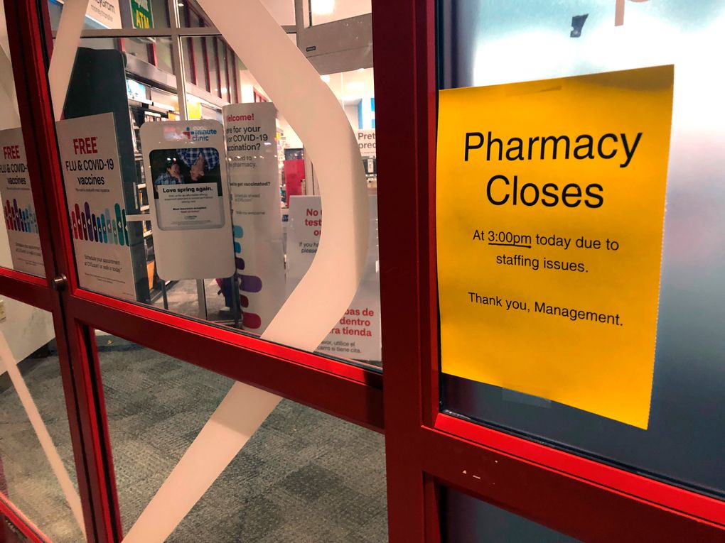 A sign is posted outside a CVS pharmacy Thursday in Indianapolis. A rush of vaccine-seeking customers and staff shortages are squeezing drugstores around the country. That has led to frazzled workers and even temporary pharmacy closures. (AP Photo/Tom Murphy)