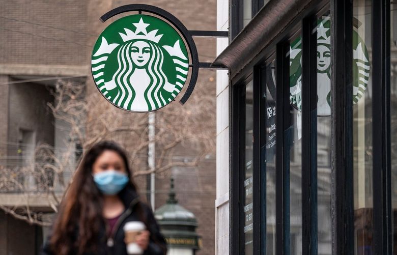 A person walks past a Starbucks coffee shop in San Francisco on Jan. 21, 2021. MUST CREDIT: Bloomberg photo by David Paul Morris