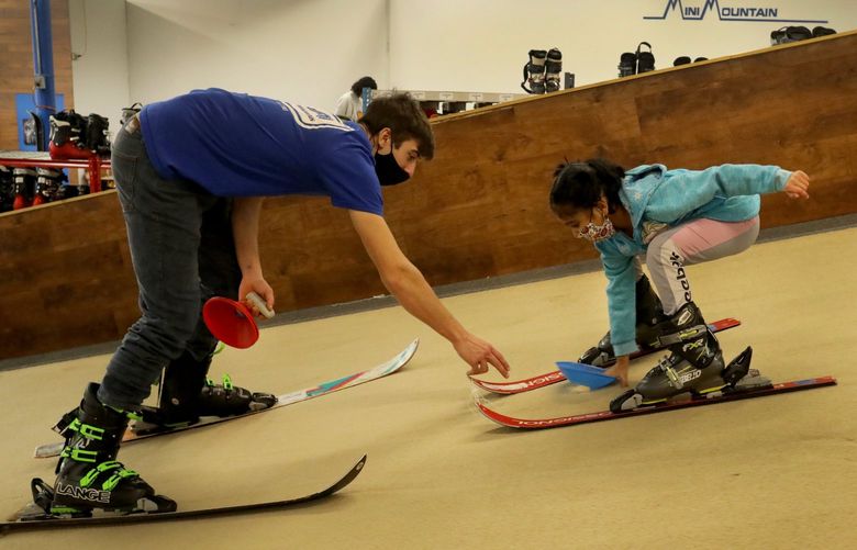 First time on skis, Sujal Bhandari gets instructions in bending and learning control from John Thomsen at the Mini Mountain Indoor Ski Center in Bellevue.  They’re on an angled moving carpet controlled by Thomsen.  Sujal is seven.

Ref to more photos online


Indoor ski lessons on a moving carpet at Mini Mountain in Bellevue.


LO linesonly

Saturday January 8, 2020 219275