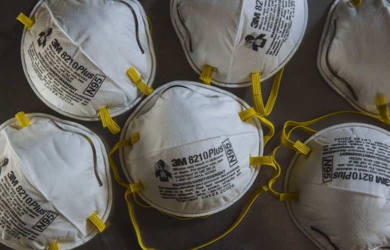 3M Co. 8210Plus N95 particulate respirators are arranged for a photograph in New York, U.S., on Wednesday, July 29, 2020. Leading Democrats in Congress, frustrated with what they say are inadequate protections against Covid-19 in air travel, introduced legislation to require the federal government to mandate face masks on flights and in airports. Photographer: Angus Mordant/Bloomberg