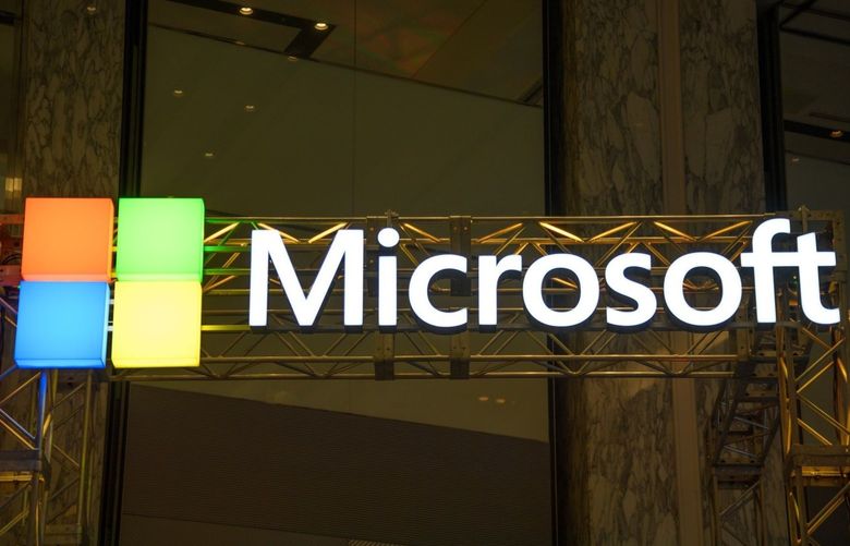 The Microsoft Corp. logo is displayed at the company’s booth during the SoftBank World 2019 event in Tokyo, Japan, on Thursday, July 18, 2019. The founders of Southeast Asian ride-hailing giant Grab, indoor farming startup Plenty, Indian hotel chain OYO Rooms and payments service Paytm took the stage at an annual SoftBank conference to explain how artificial intelligence helps them stay on top in their respective fields.
