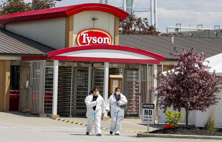 FILE – In this May 7, 2020 file photo, workers leave the Tyson Foods pork processing plant in Logansport, Ind. Meatpacking giant Tyson Foods says more than 96% of its workers have been vaccinated ahead of a Nov. 1 deadline for them to do so. The Springdale, Ark., based company said the number of its 120,000 workers who have been vaccinated has nearly doubled since it announced its mandate on Aug. 3. At that point, only 50% of Tyson workers had been vaccinated. (AP Photo/Michael Conroy, File) CER201