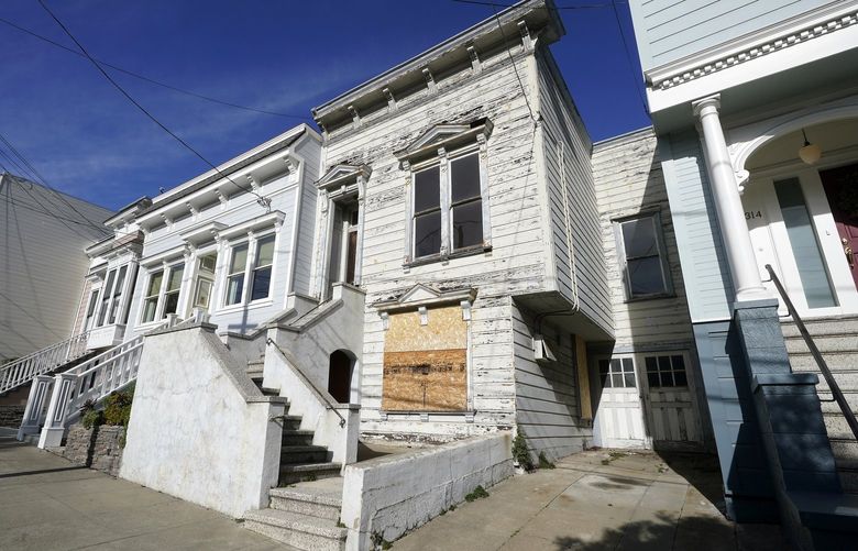 A recently sold Victorian home is shown in San Francisco, Friday, Jan. 14, 2022. The decaying, 122-year-old Victorian marketed as “the worst house on the best block” of San Francisco recently sold for nearly $2 million â€” an eye-catching price that the realtor said was the outcome of overbidding in an auction. (AP Photo/Jeff Chiu) CAJC502 CAJC502