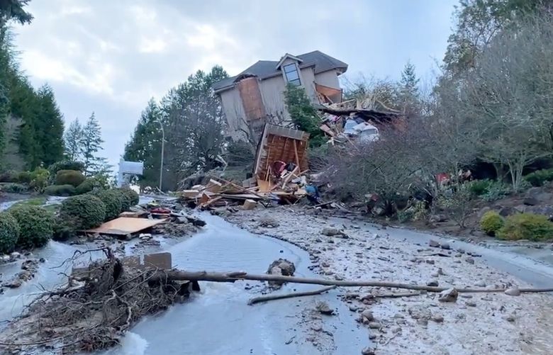 A Bellevue home slid off its foundation and partially collapsed Monday. Bellevue police said water gushed down a hillside from an unknown source. (Bellevue Police Department)