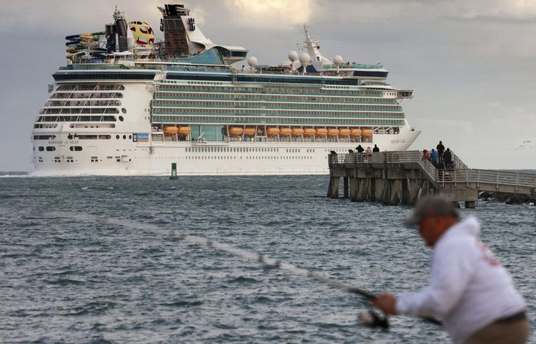 Royal Caribbean’s Mariner of the Seas departs Port Canaveral, Fla., on a 4-night Bahamas cruise, Tuesday, Jan. 11, 2021. Royal Caribbean temporarily suspended cruise operations on three of its ships sailing from other Florida ports earlier in the week due to the surge of COVID cases in the state. (Joe Burbank/Orlando Sentinel via AP) FLORL400 FLORL400