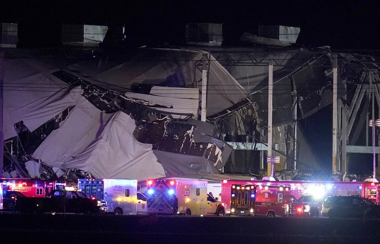 FILE – An Amazon distribution center is heavily damaged after a strong thunderstorm moved through the area, Dec. 10, 2021, in Edwardsville, Ill. The family of a delivery driver who died last month when a tornado collapsed the central Illinois Amazon facility where he worked filed a wrongful death lawsuit Monday, Jan. 17, 2022 in Madison County. (AP Photo/Jeff Roberson) NYPS213 NYPS213