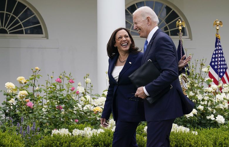 FILE – President Joe Biden walks with Vice President Kamala Harris after speaking on updated guidance on face mask mandates and COVID-19 response, in the Rose Garden of the White House, May 13, 2021, in Washington. Harris is capping off a controversial first year in office, creating history as the first woman of color in her position while fending off criticism and complaints over her focus and agenda. While sheâ€™s sought to make the office her own, Harris has struggled at times with the constraints of a global pandemic and the realities of a role focused squarely on promoting the president. (AP Photo/Evan Vucci, File) WX202 WX202